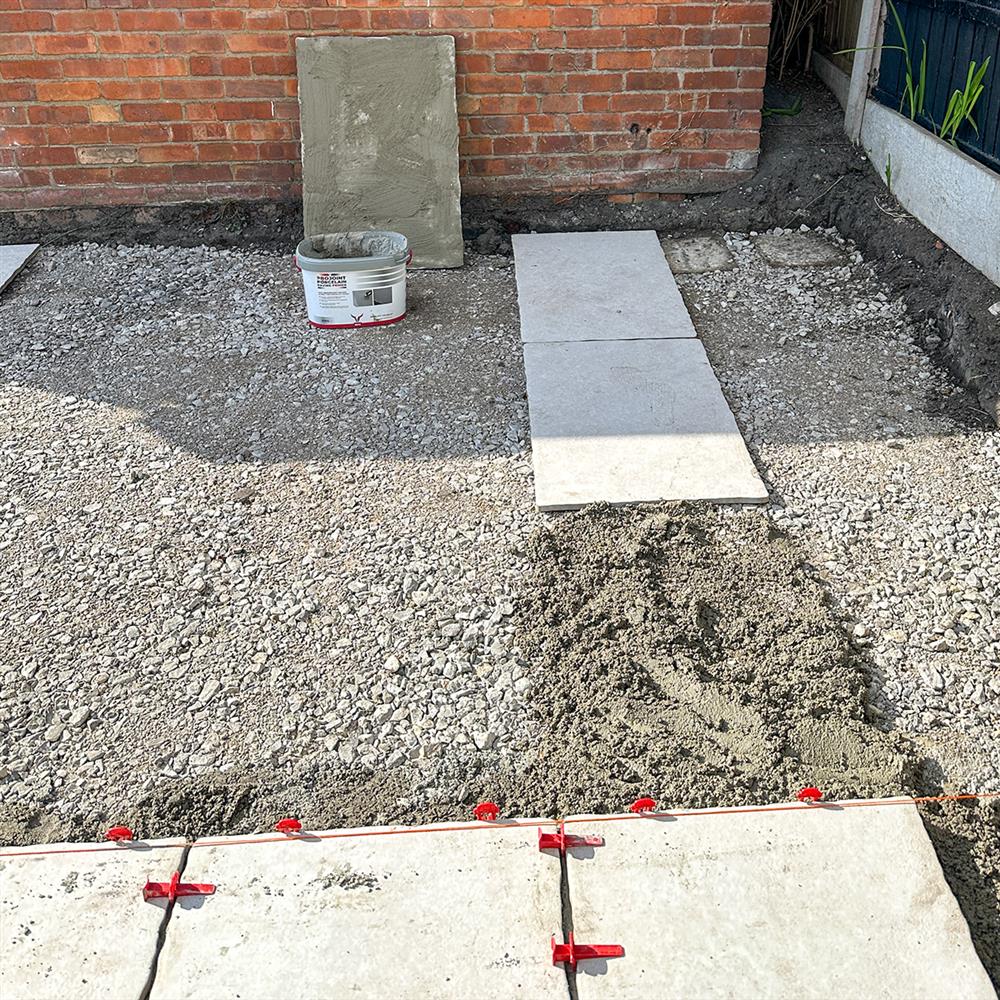 Installing patio paving slabs on a sub-base on top of soil